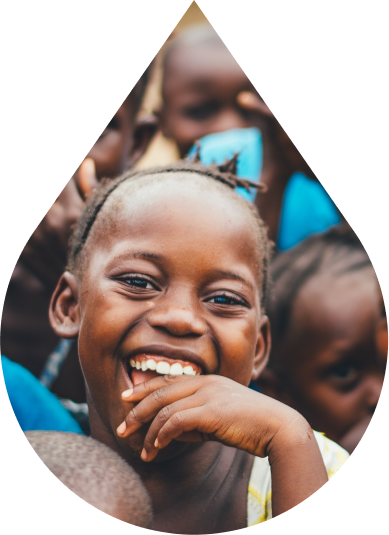 Close-up of a kid's smiling face in a droplet icon